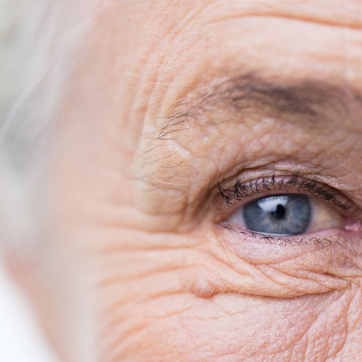 Senior Woman blue eyes supports regular eye exams